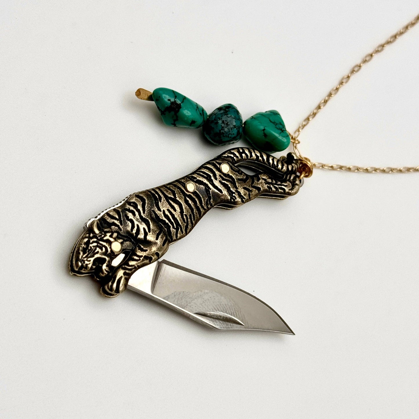 Untamed Necklace by Fluff Hardware featuring a bold, artistic pendant on a delicate chain, displayed against a neutral background.