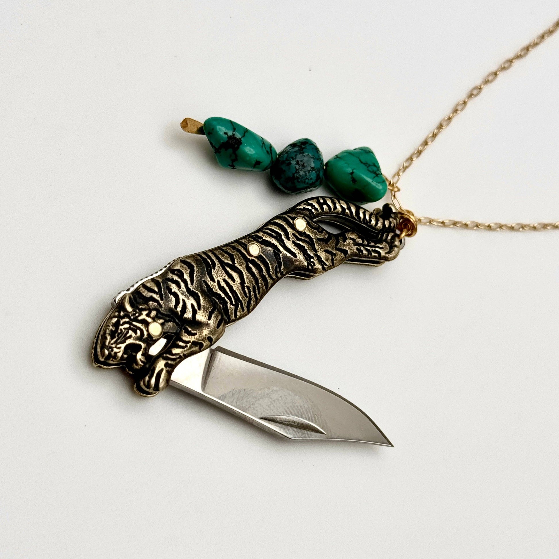 Untamed Necklace by Fluff Hardware featuring a bold, artistic pendant on a delicate chain, displayed against a neutral background.