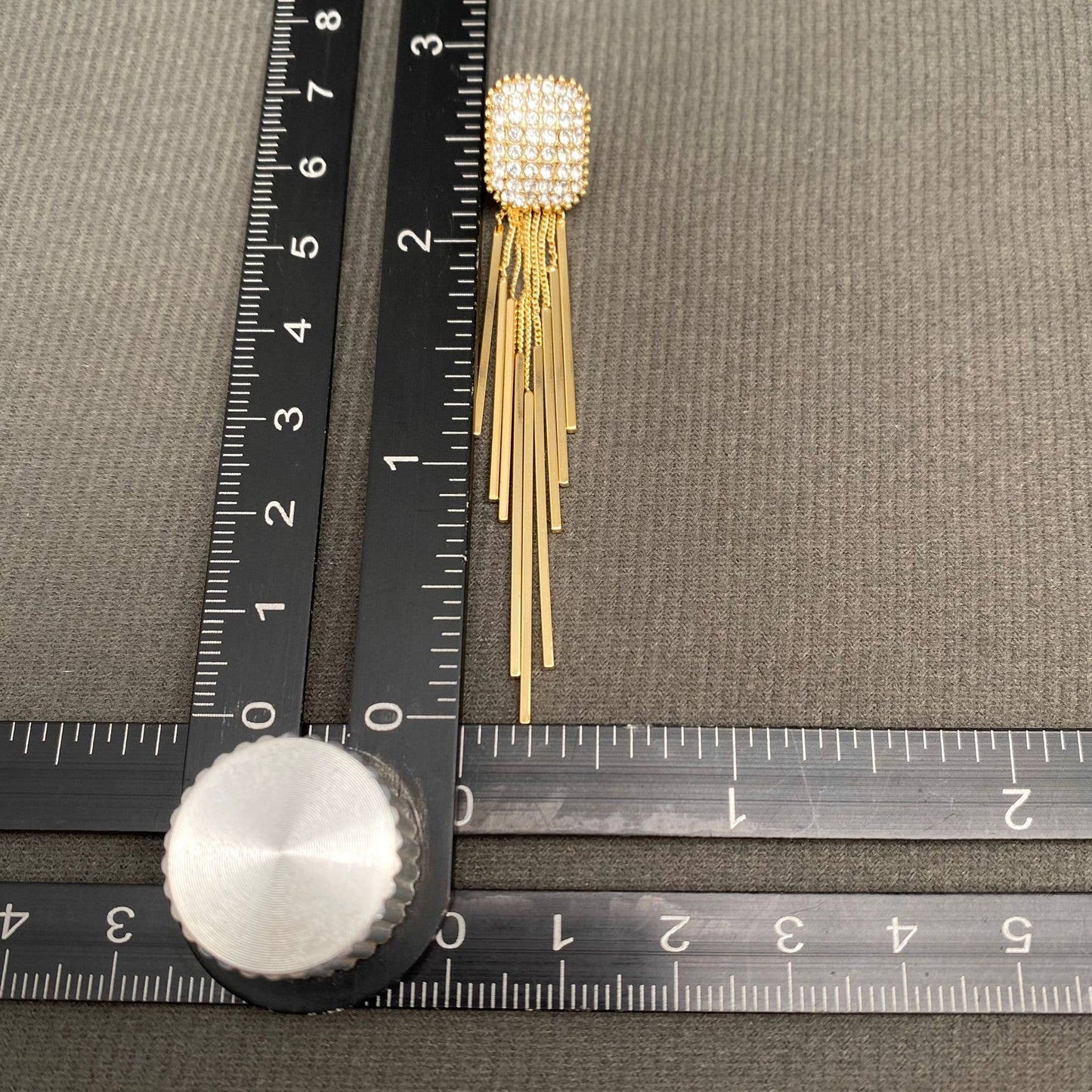 Gold fringe rhinestone earrings by Mio Queena featuring sparkling rhinestones and elegant fringe design.