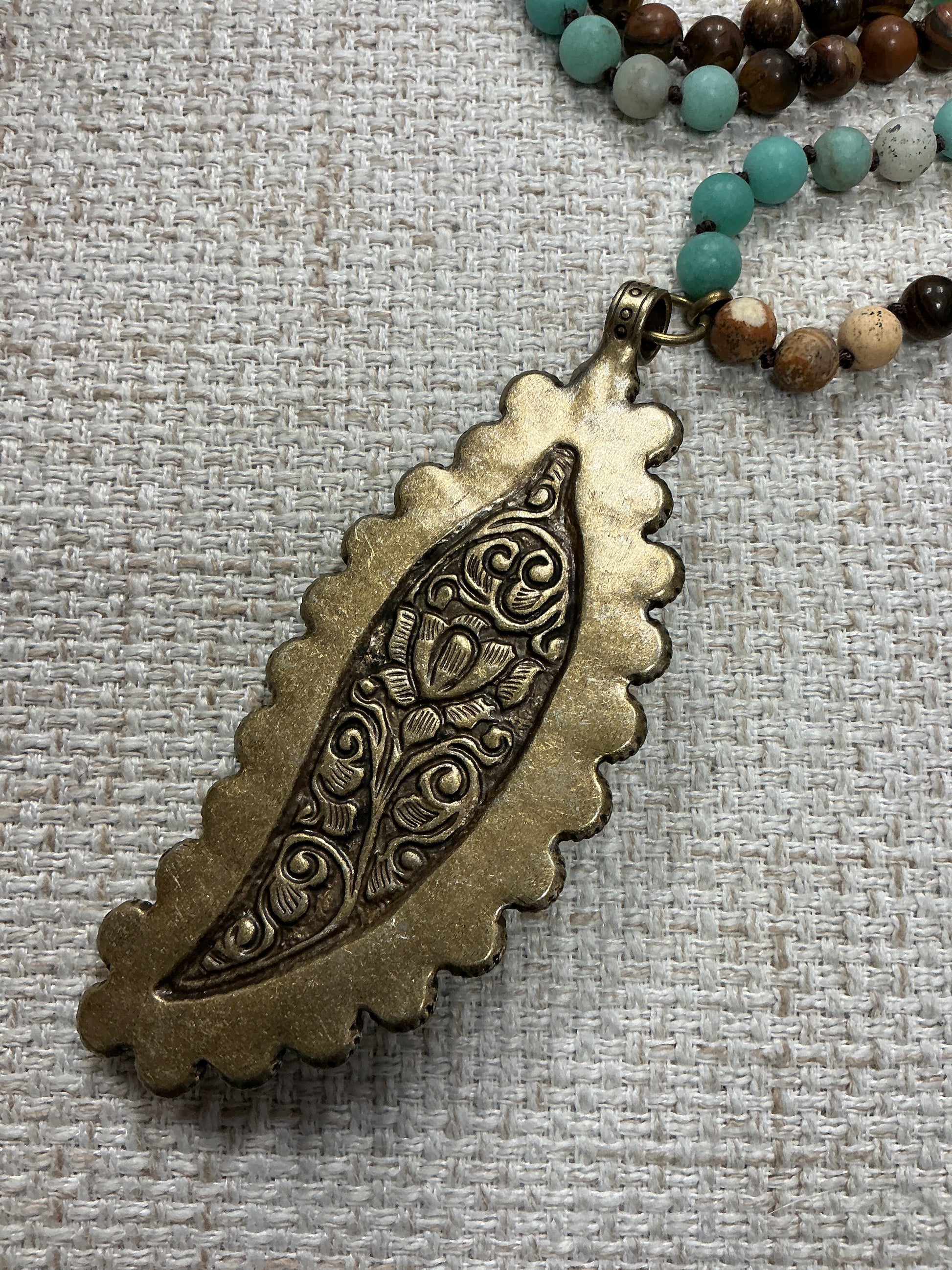 Beaded feather talisman necklace with colorful beads and feather pendant, American Unique Group jewelry accessory