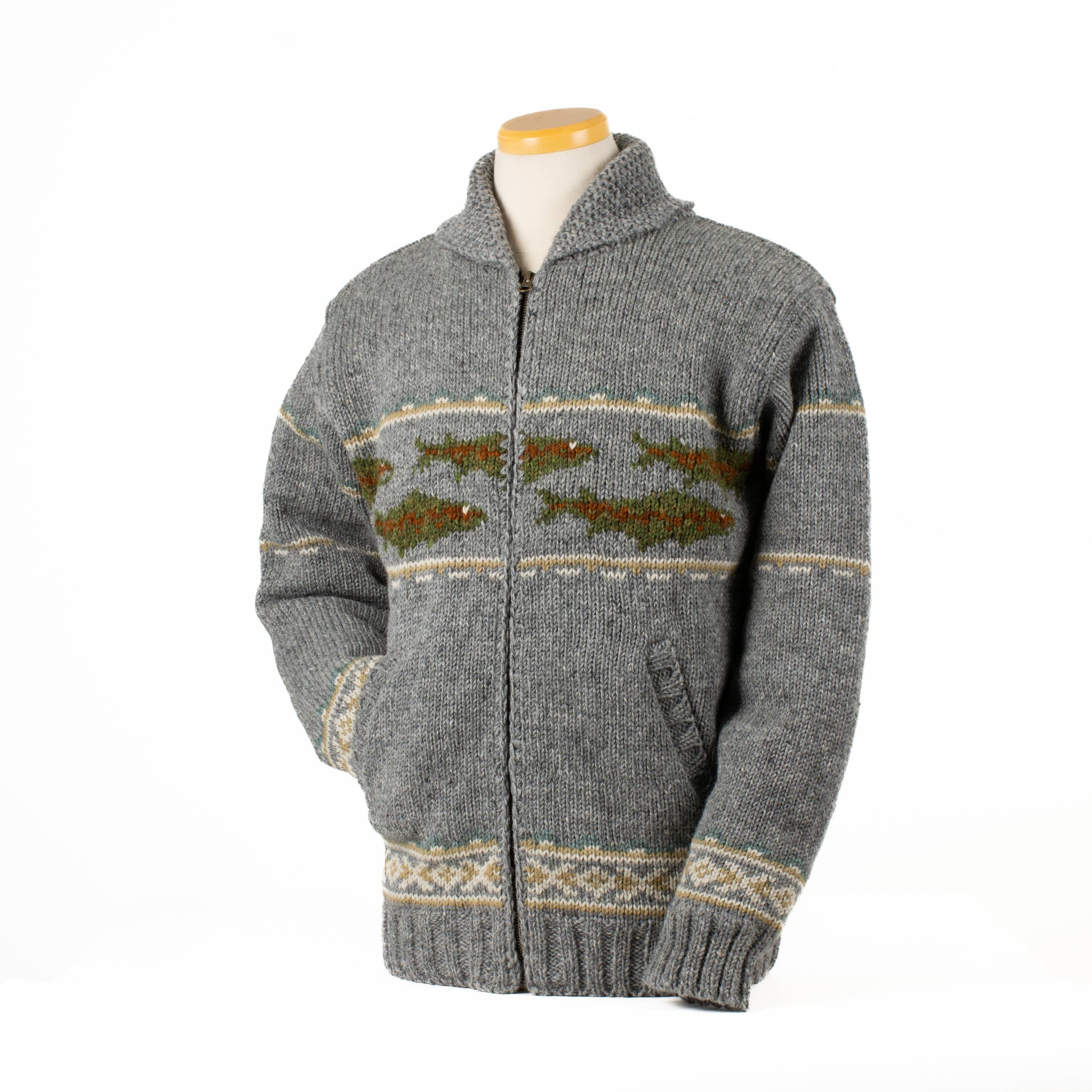 Lost Horizons Knitwear Gone Fishing sweater, cozy knit sweater with fishing motif, in a natural outdoor setting.