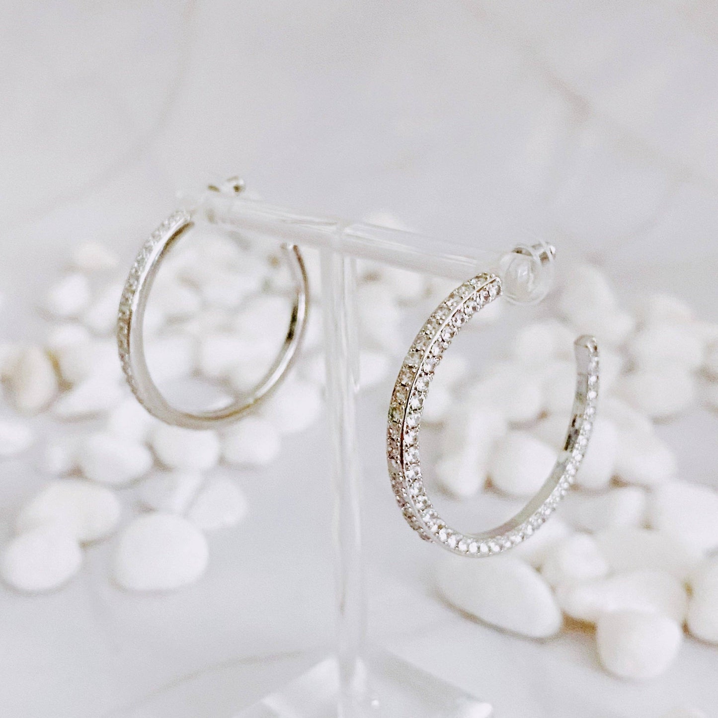 Reversible hoop earrings by Ellison+Young featuring plain and shiny finishes, shown in a close-up image.