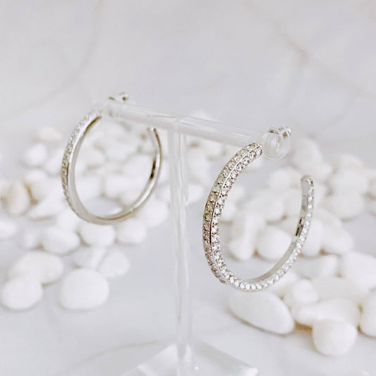 Reversible hoop earrings by Ellison+Young featuring plain and shiny finishes, shown in a close-up image.