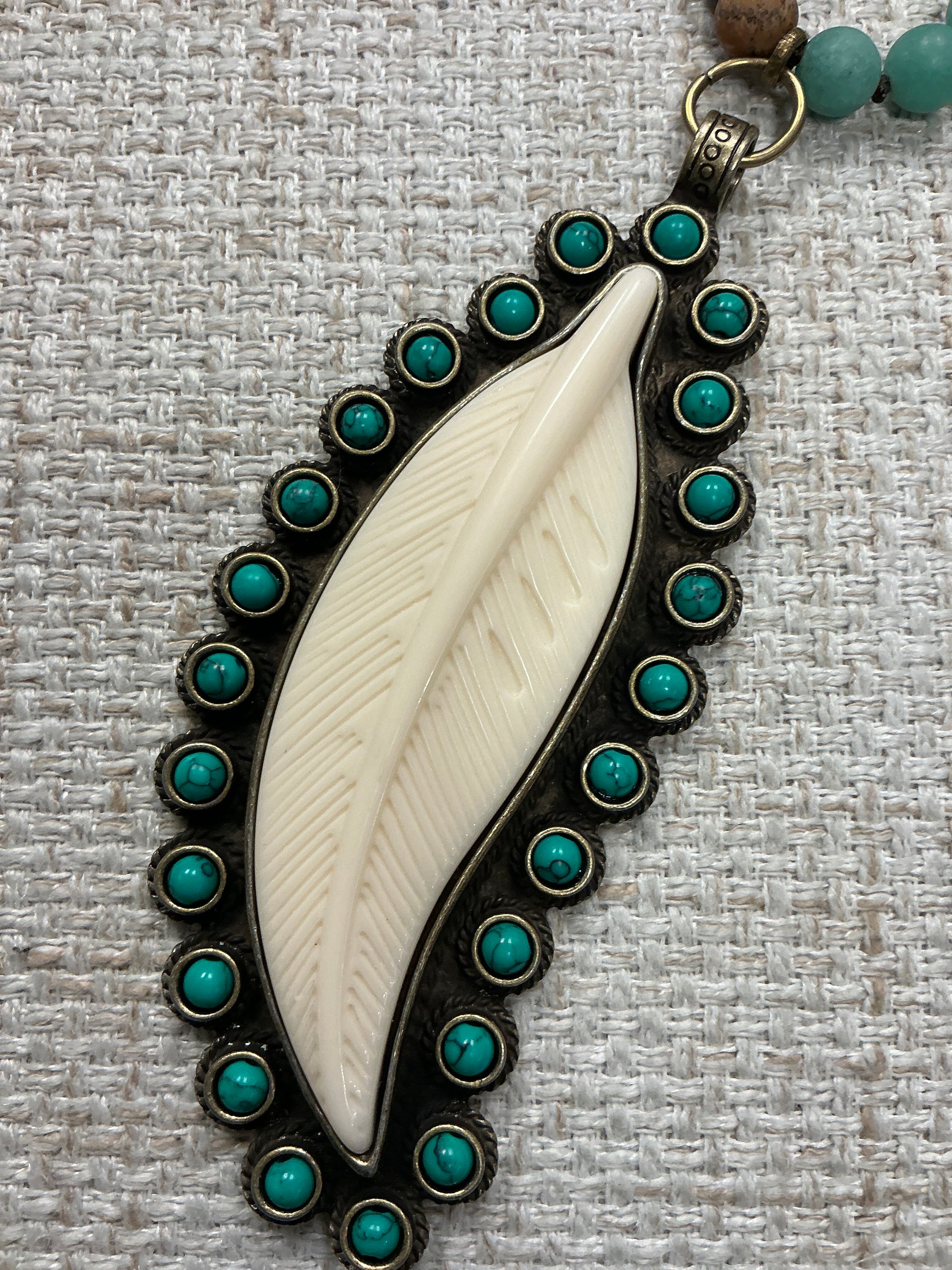 Beaded feather talisman necklace with colorful beads and feather charm, American Unique Group jewelry accessory