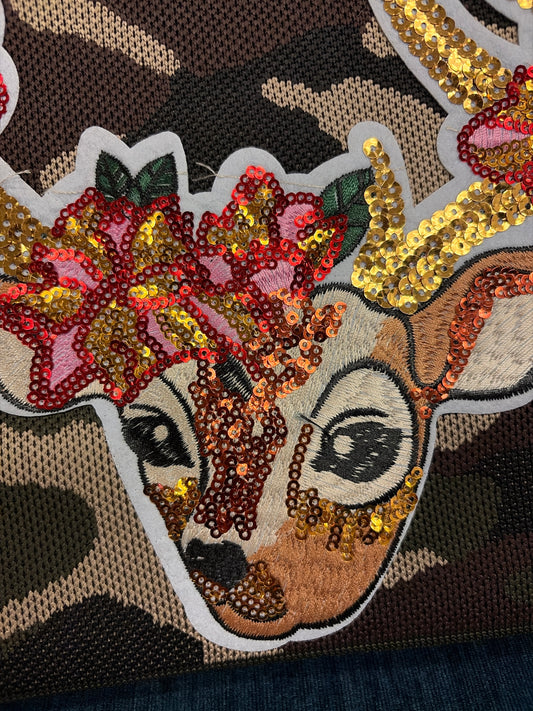 Queen Gypsy Buck on Camo Bag showing the bag's camo pattern and buck embellishment, made from durable fabric for casual use.