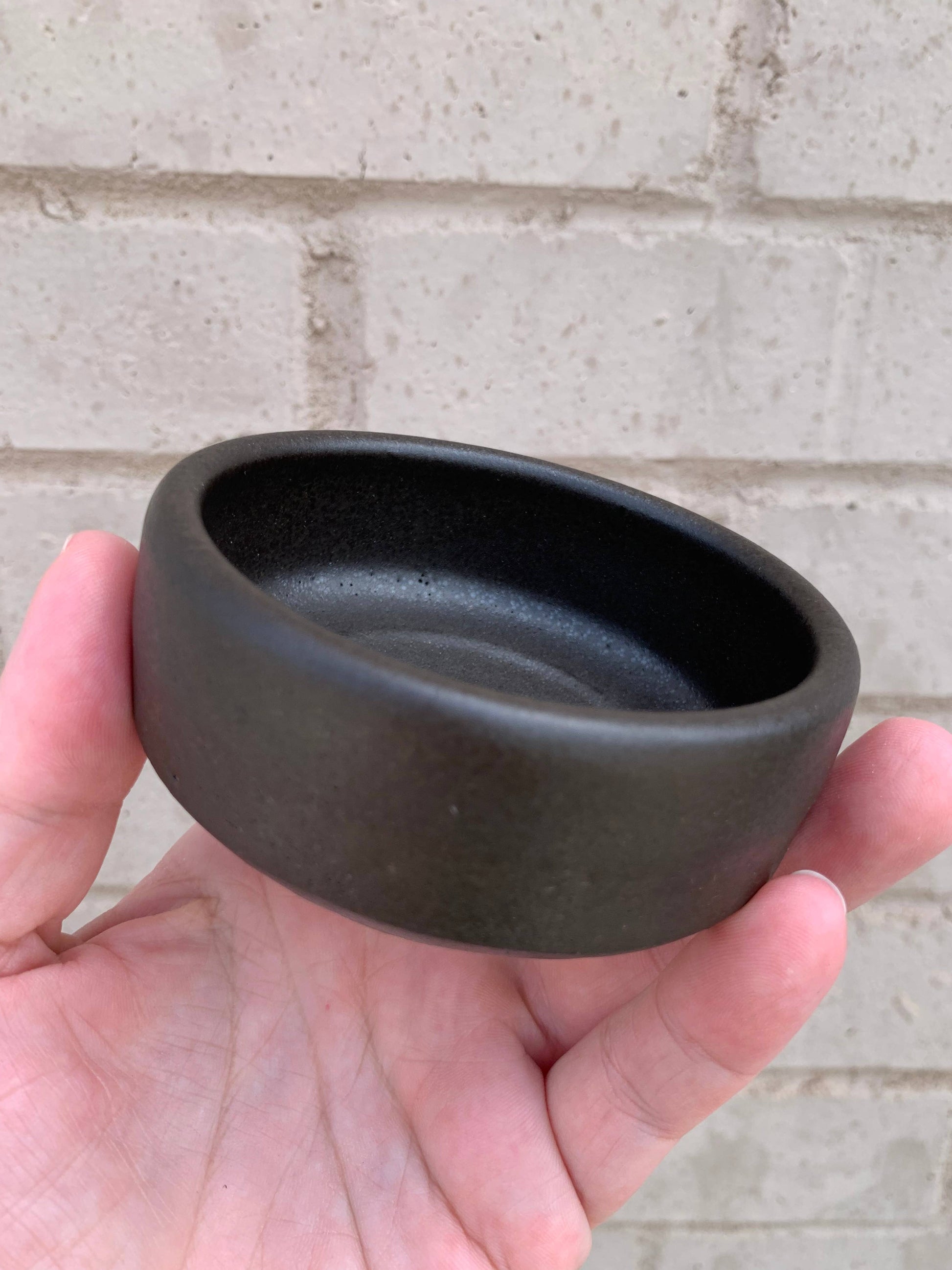 Handmade ceramic shaving bowl from The Immaculate Beard, featuring a smooth, rounded design ideal for grooming and lathering.