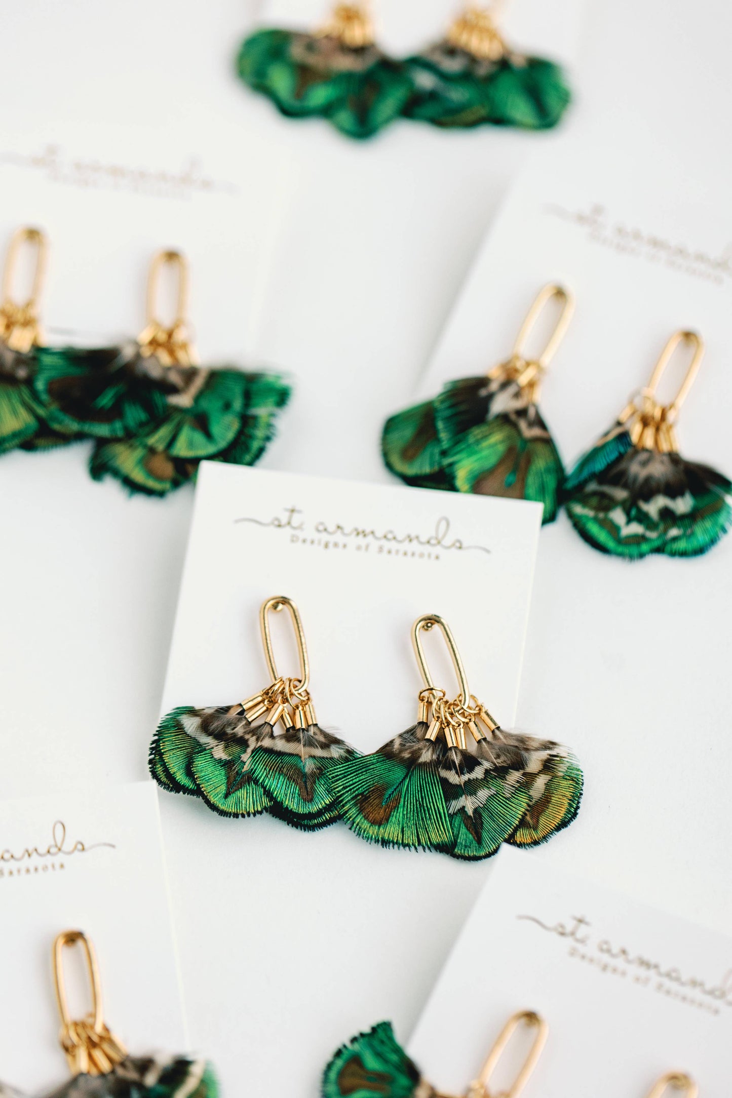 St Armands Designs of Sarasota mallard feather tassel earrings featuring delicate feather details and tassel embellishments.