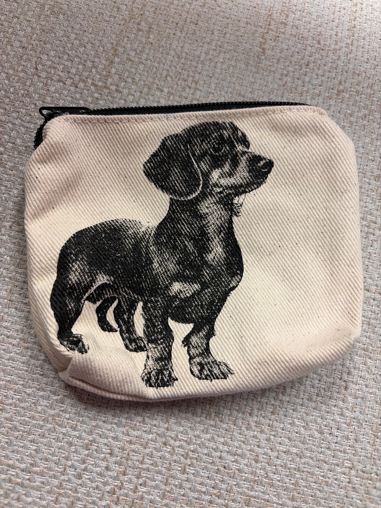 Canvas zip pouch from Rubyzaar featuring a compact bag with a zipper closure and natural fabric design.