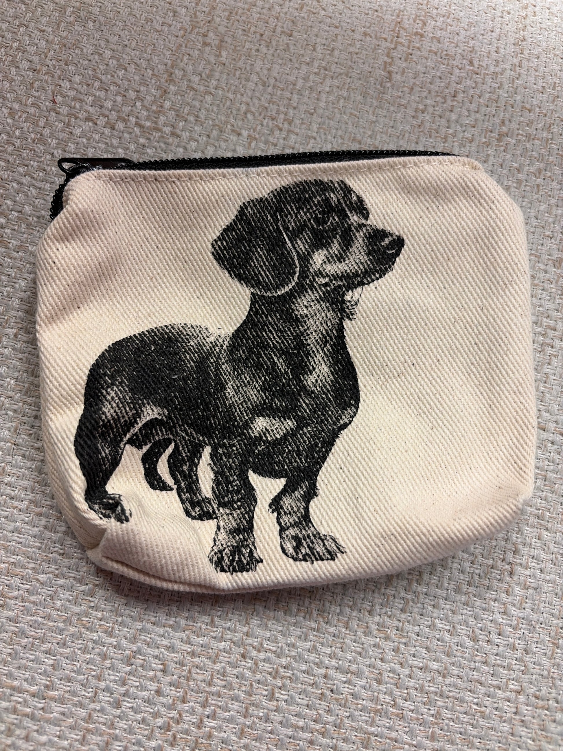 Canvas zip pouch from Rubyzaar featuring a compact bag with a zipper closure and natural fabric design.