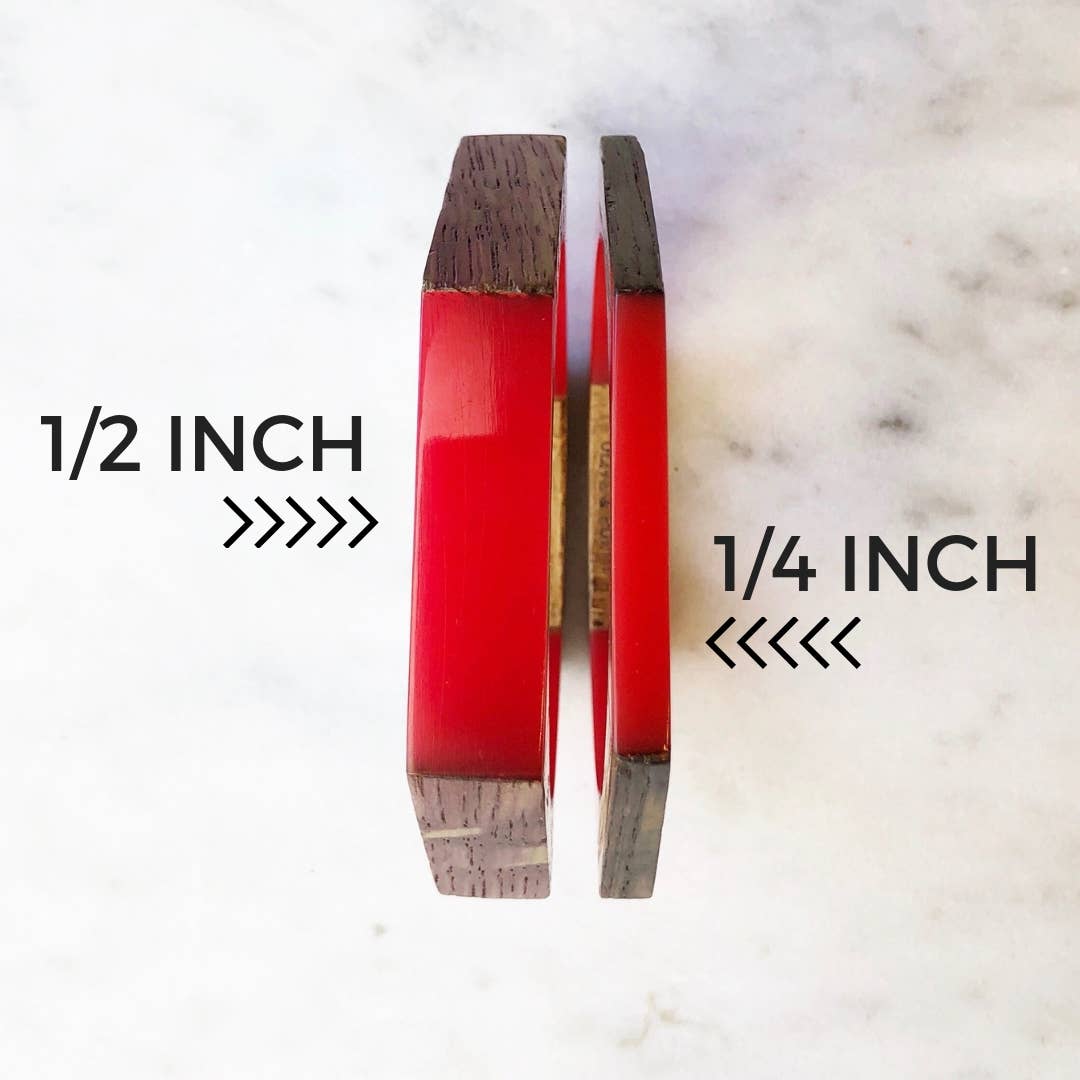 Olive and Poppy 1/2-inch barrel bracelet featuring sleek, cylindrical metal beads on a flexible bracelet band.