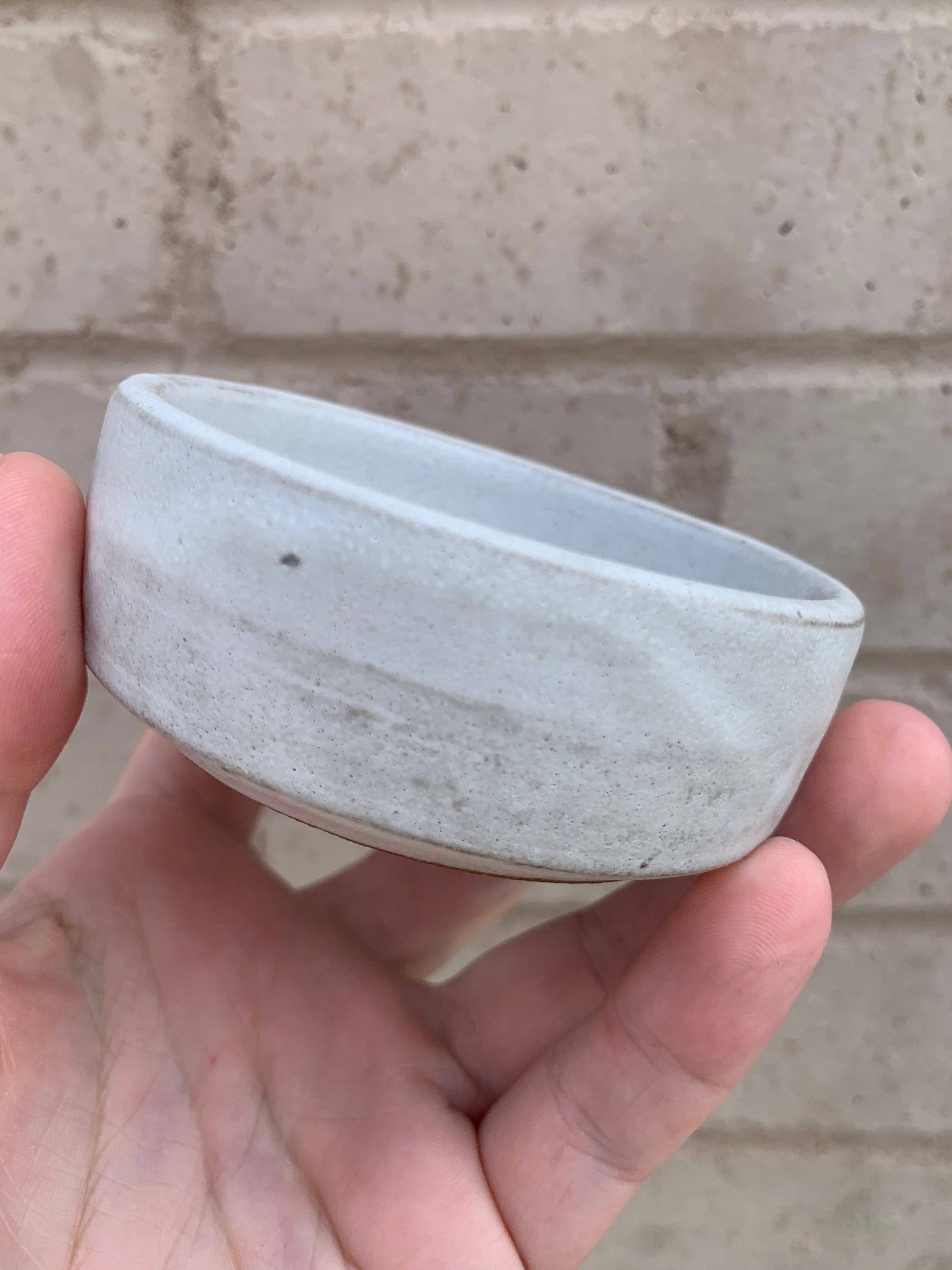 Handmade ceramic shave bowl by The Immaculate Beard with a smooth, rounded shape and a glossy finish for grooming and lathering.