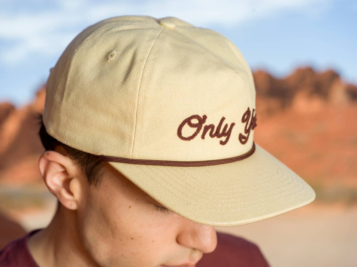 The Landmark Project Only You Chain Stitch Hat, a stylish hat with chain stitch embroidery, shown in a natural light setting.