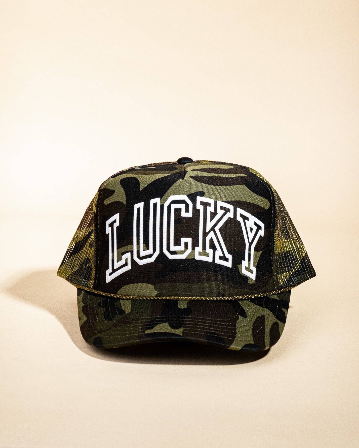 Ascot + Hart Lucky Trucker hat featuring a classic design with adjustable strap and embroidered logo, perfect for casual wear.