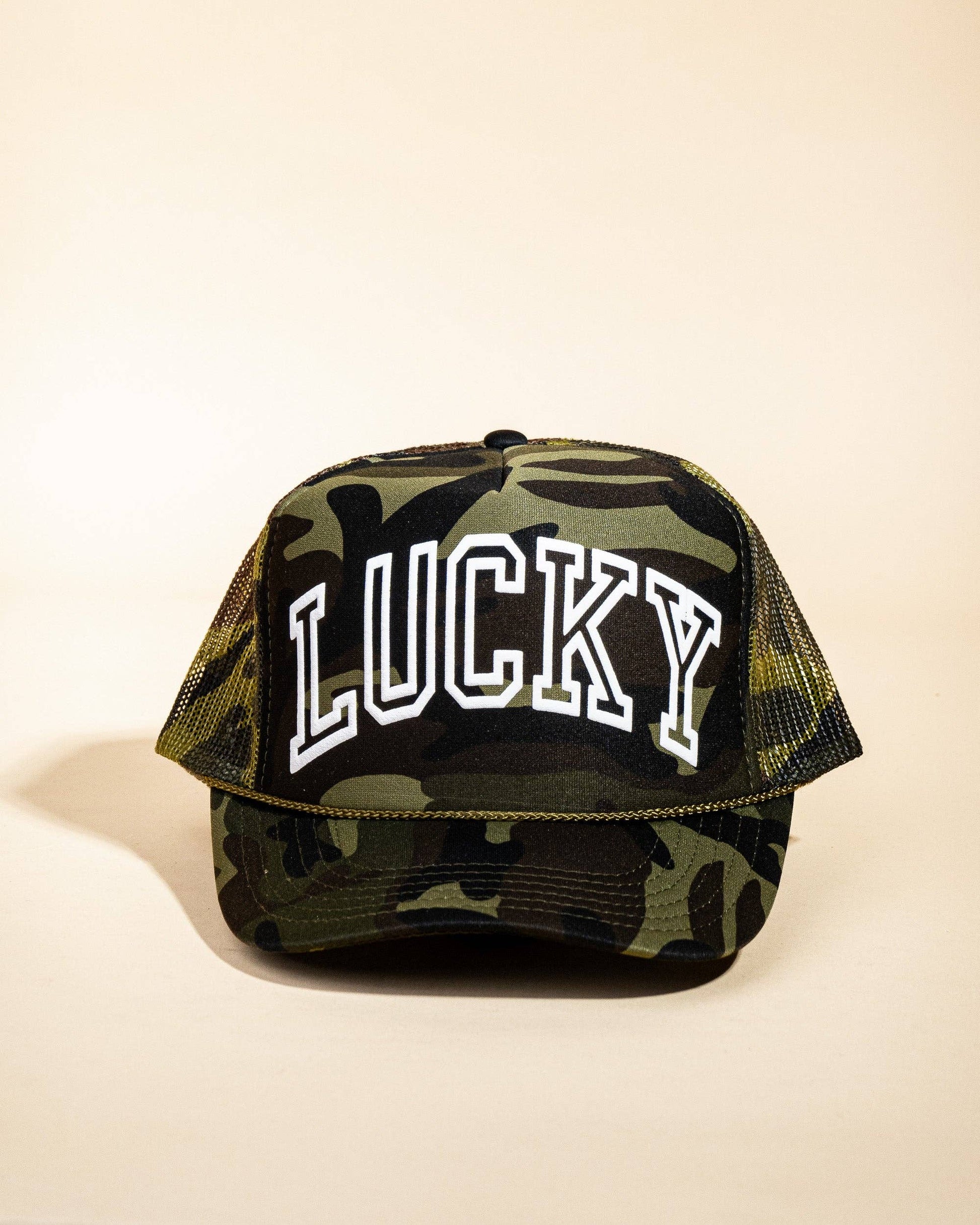 Ascot + Hart Lucky Trucker hat featuring a classic design with adjustable strap and embroidered logo, perfect for casual wear.