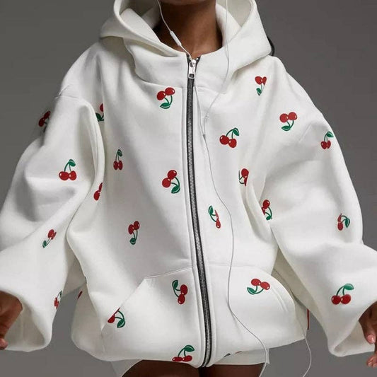 KK Bloom oversized hooded cherry zip-up sweatshirt with front pockets and a relaxed fit, shown on a model.