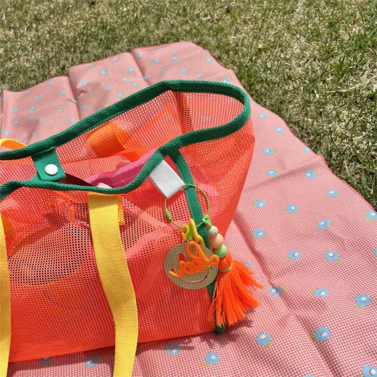 ACCITY mesh beach bag with breathable mesh design, sturdy handles, and spacious interior for carrying beach essentials.