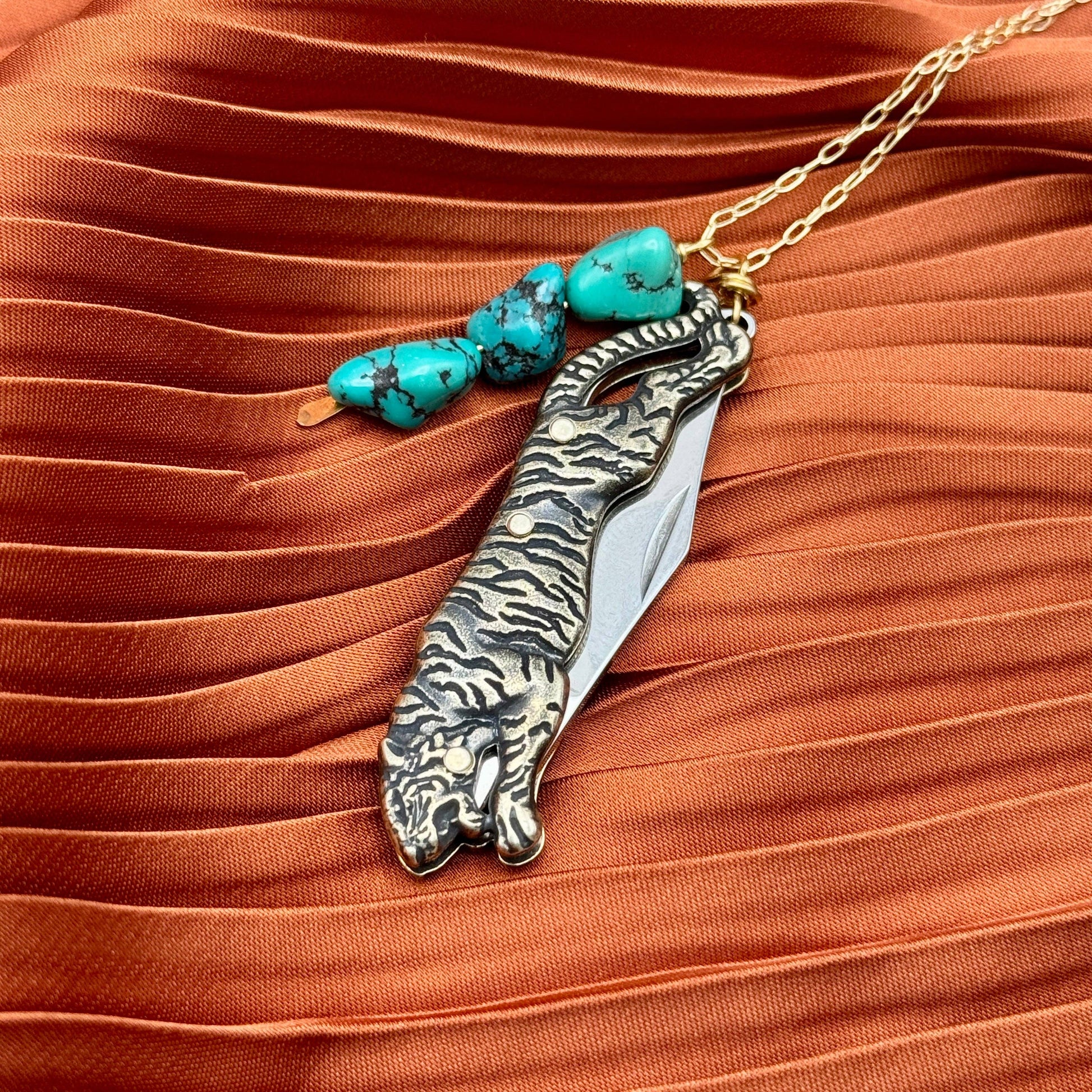 Untamed Necklace by Fluff Hardware featuring a bold, modern design with intricate metal details in a close-up shot.