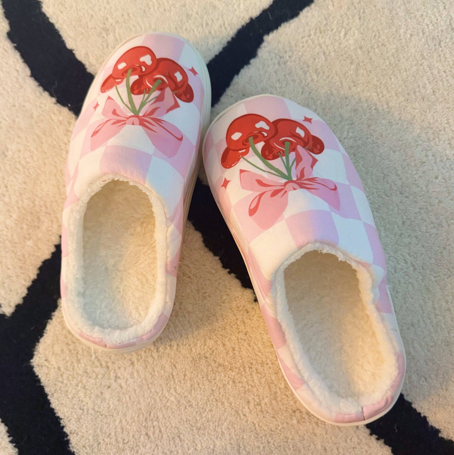 Ellison+Young Cherry Bow Check Lounge Slippers with cozy design and bow detail, perfect for relaxing at home.