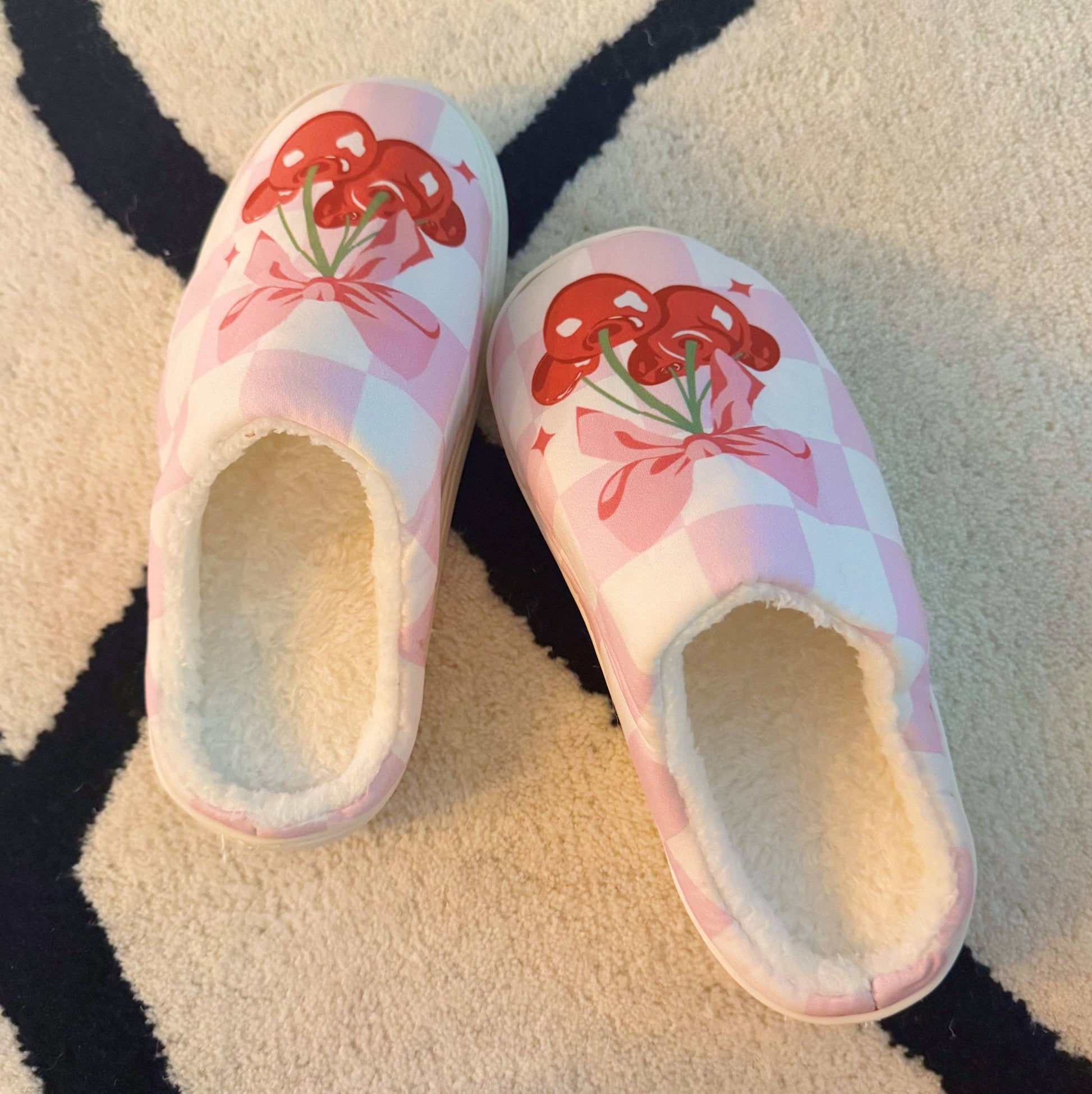 Ellison+Young Cherry Bow Check Lounge Slippers with cozy design and bow detail, perfect for relaxing at home.
