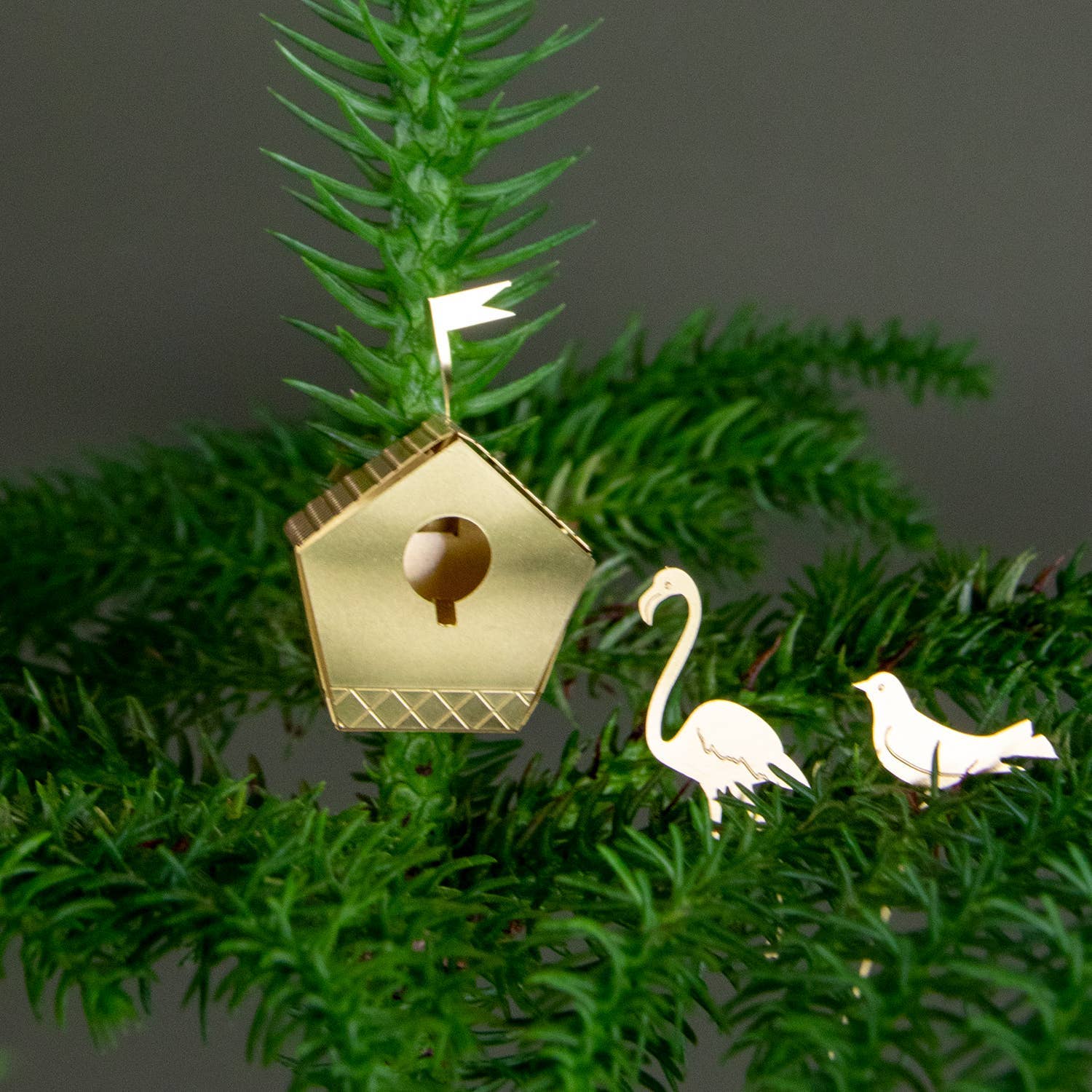Small Botanopia USA birdhouse gift for plants, featuring a tiny decorative birdhouse ideal for plant lovers' decor.