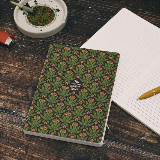 A Questionables notepad titled "Amazingly Creative Journal" with blank pages, ideal for writing and sketching.