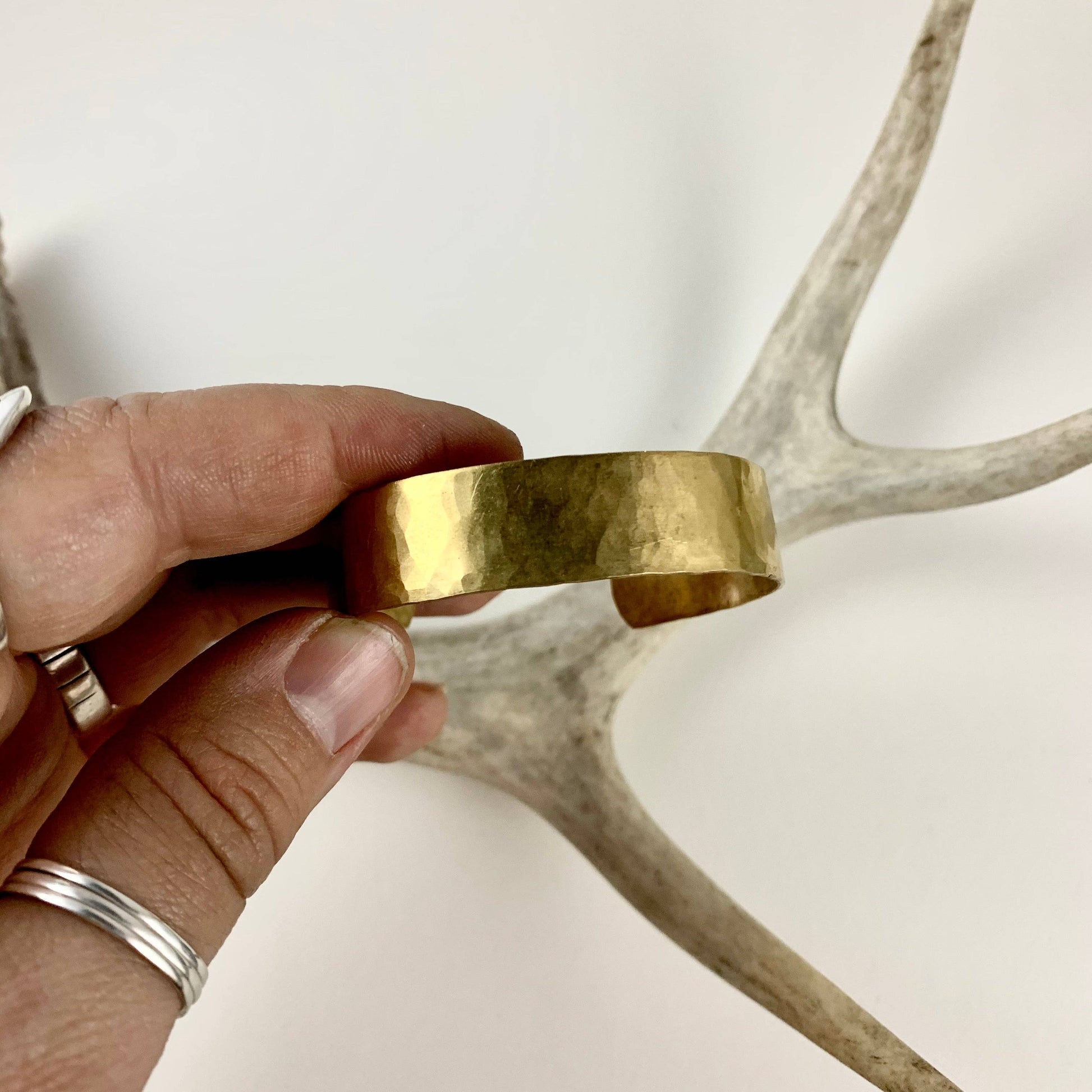 Handmade She-ra style cuffs bracelet by Fluff Hardware with detailed metalwork and bold design.