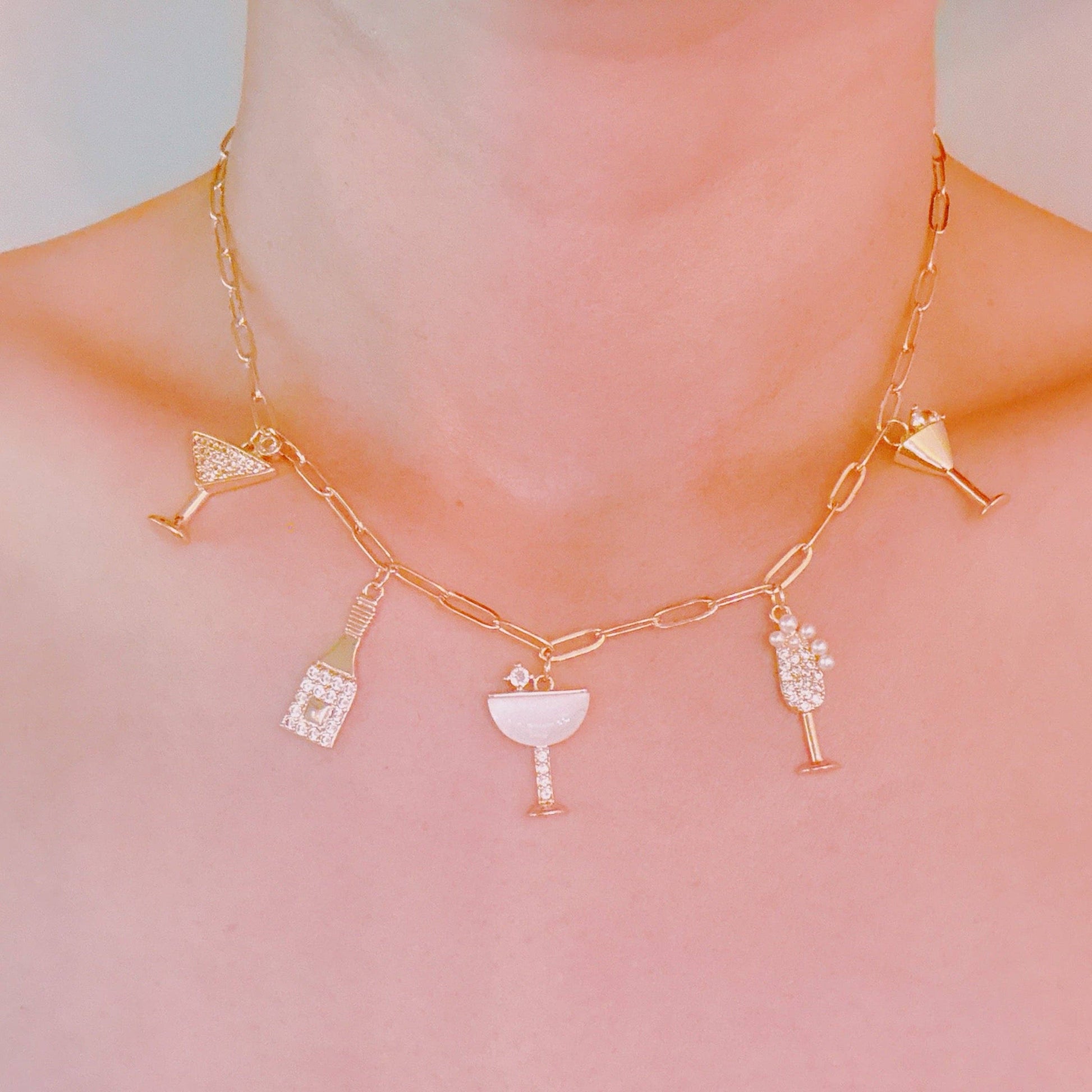 Ellison+Young Cheers To Happiness multi charm necklace with colorful pendants and silver chain, close-up view showing detailed charms.