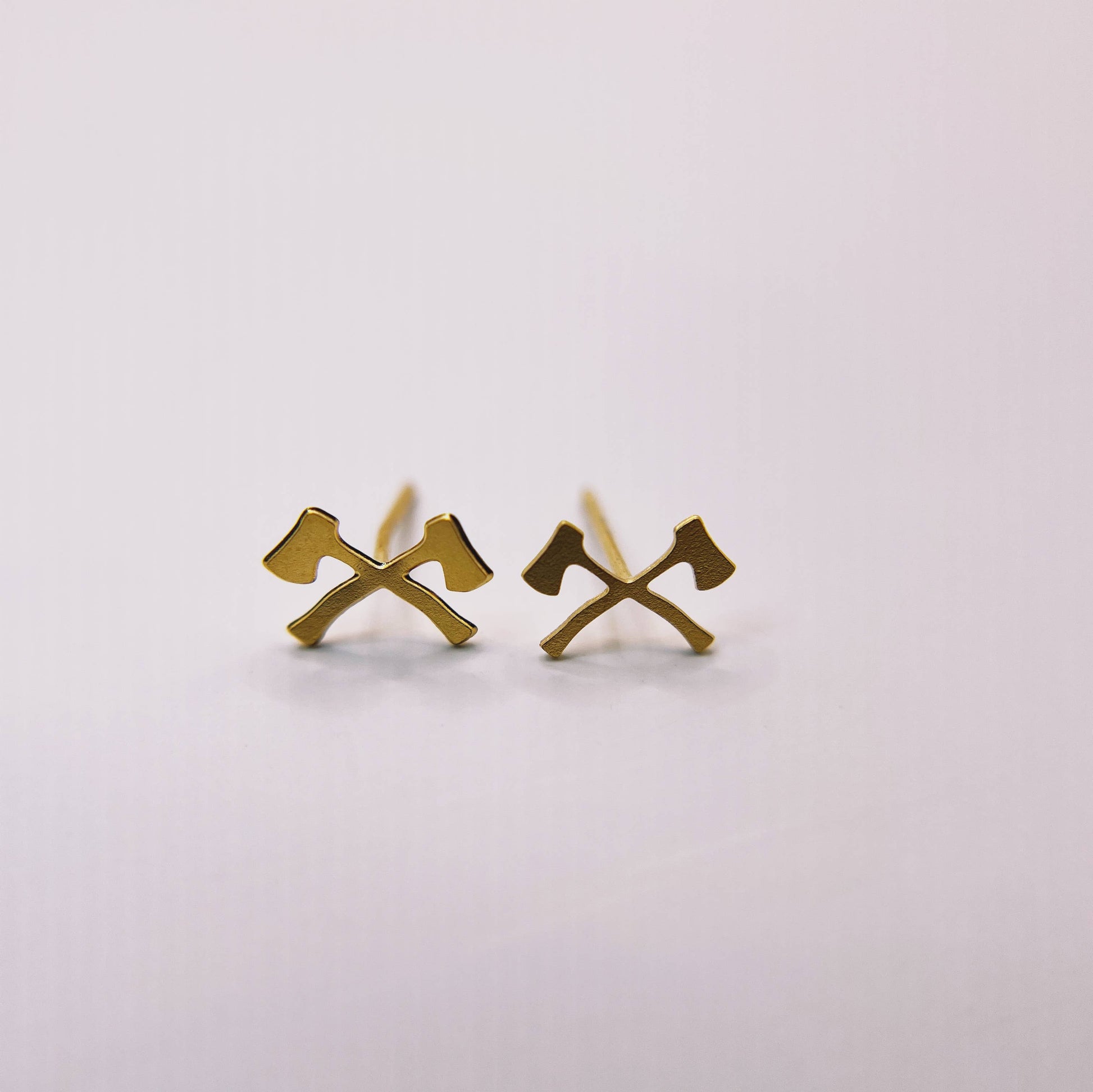 Made of Mountains Mini Forest Axe Stud Earrings featuring small forest axe designs in metal for women and men.