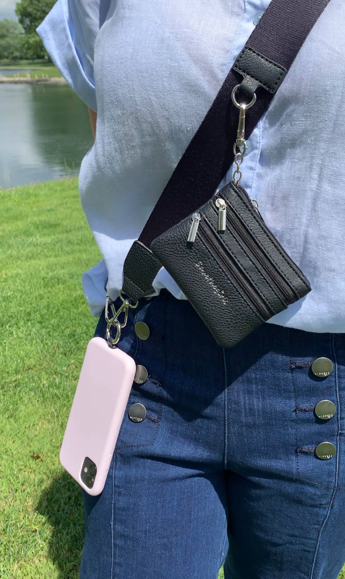 Save The Girls Clip & Go crossbody strap with zippered pouch for phones, featuring a stylish and functional design.