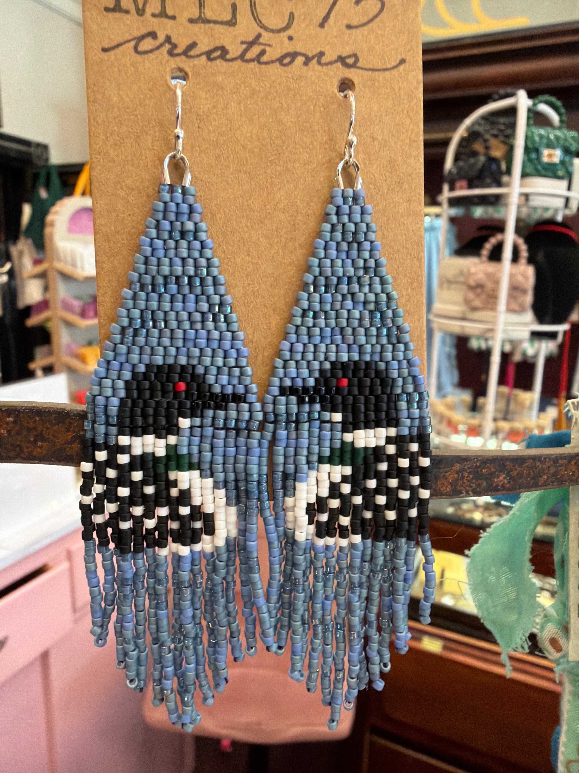 Hand beaded loon earrings by MLC73 featuring intricate beadwork and a loon bird design, perfect for nature-inspired jewelry.