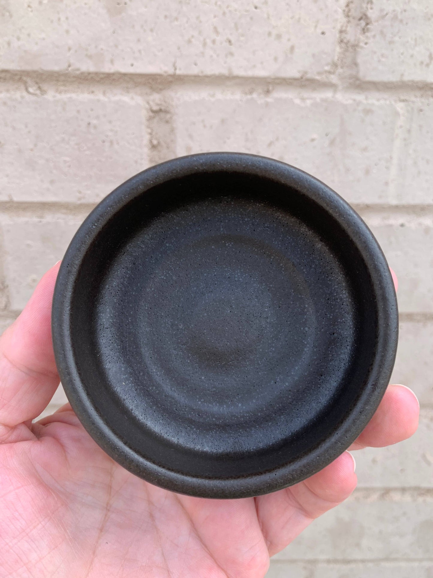 Handmade ceramic shaving bowl from The Immaculate Beard with a smooth, rounded design and glossy finish.