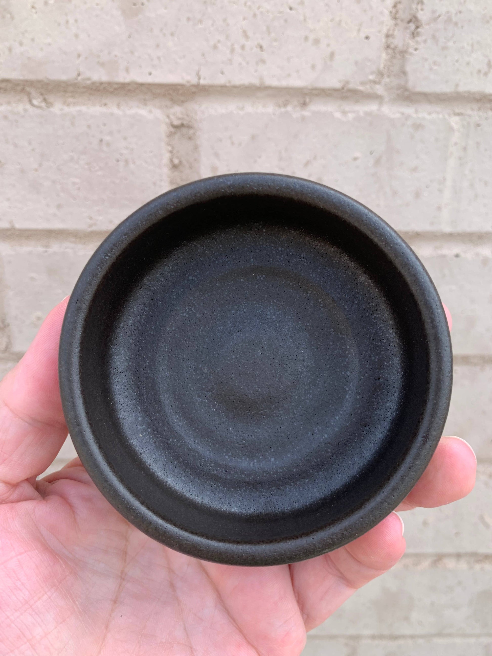 Handmade ceramic shaving bowl from The Immaculate Beard with a smooth, rounded design and glossy finish.