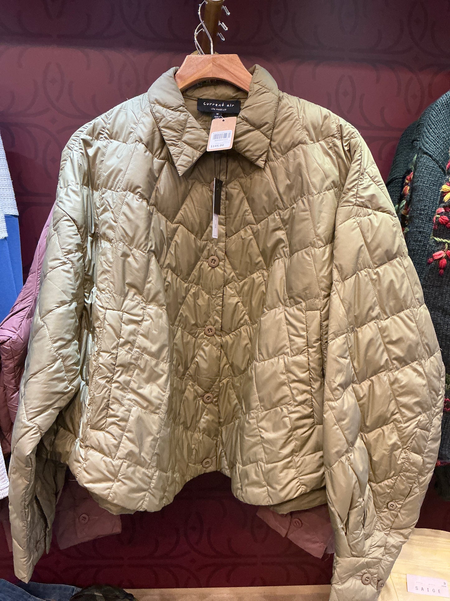 Current Air duck down cropped jacket showing a fitted, insulated jacket with a high collar and quilted design for warmth.