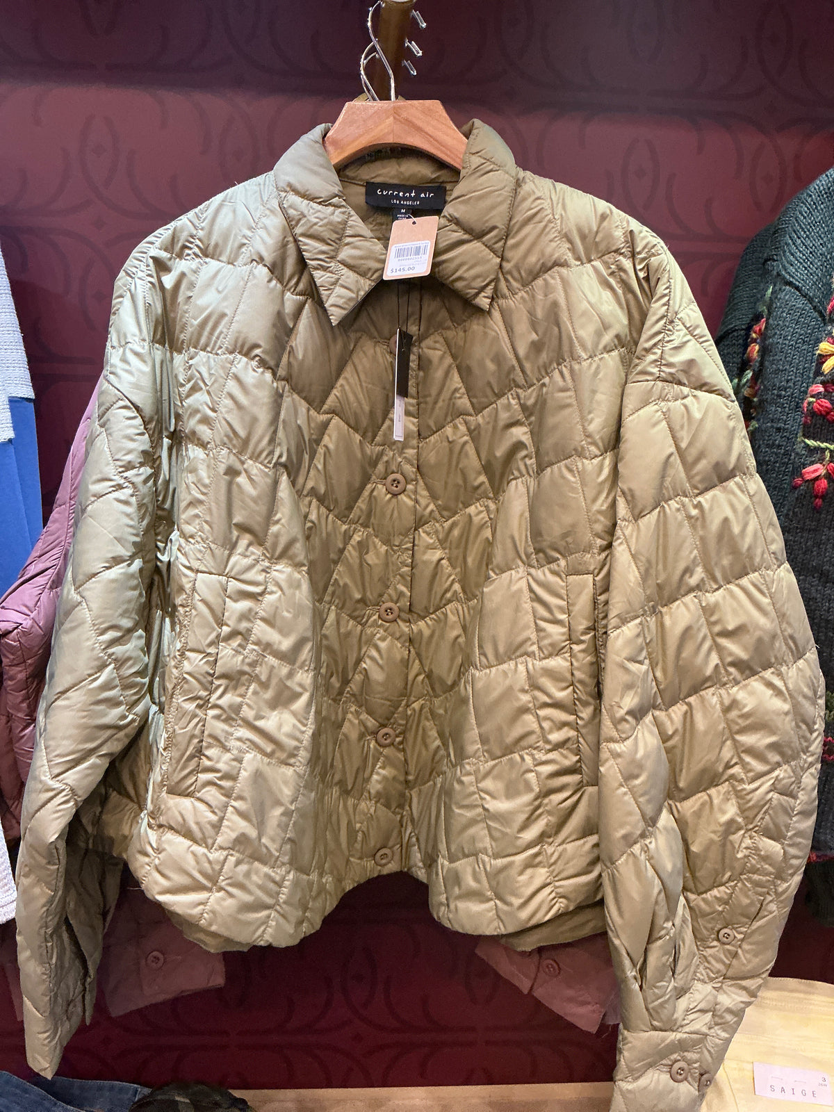 Current Air duck down cropped jacket showing a fitted, insulated jacket with a high collar and quilted design for warmth.