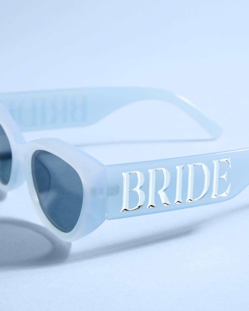 Blue bride embossed sunglasses from xo, Fetti, with "Something Blue" design, perfect for bachelorette parties and bridal gifts.