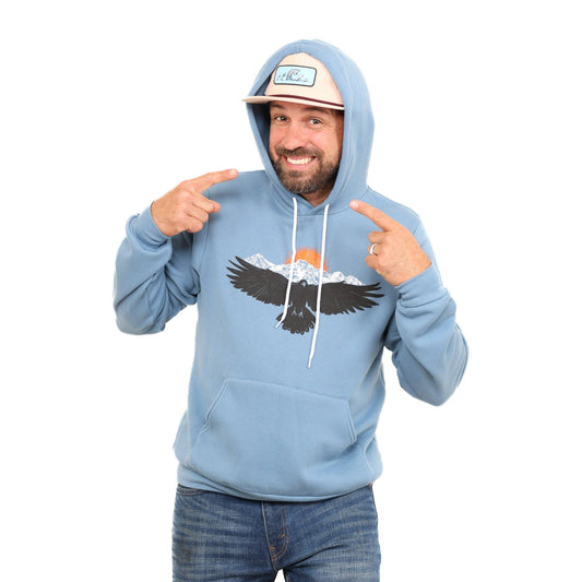 Slow Loris Raven Mountain hoodie, black pullover hoodie with mountain graphic, soft fabric, and adjustable drawstrings.