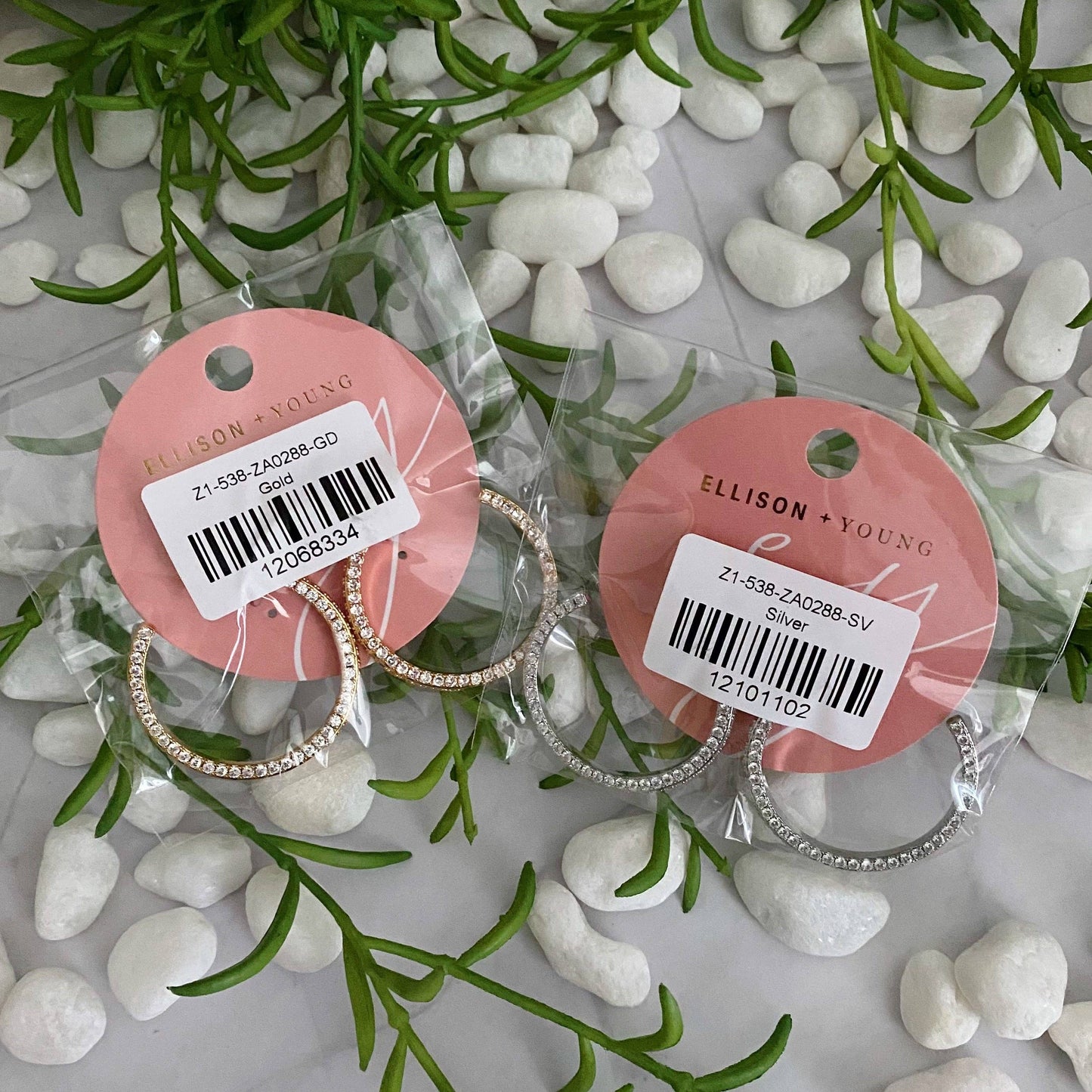 Reversible hoop earrings by Ellison+Young featuring a plain and shiny finish, shown in a close-up image of the jewelry.