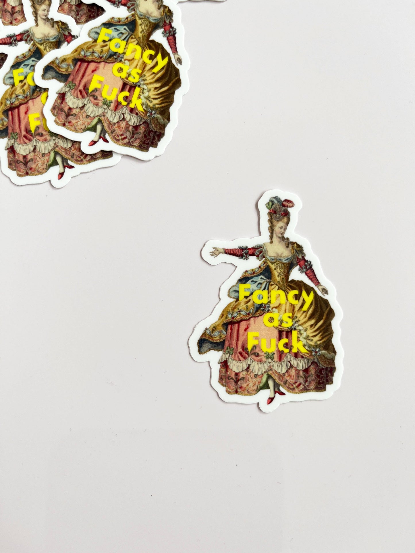 Funny sticker from The Coin Laundry with bold "Fancy as Fuck" text, perfect for decorating laptops, notebooks, or water bottles.