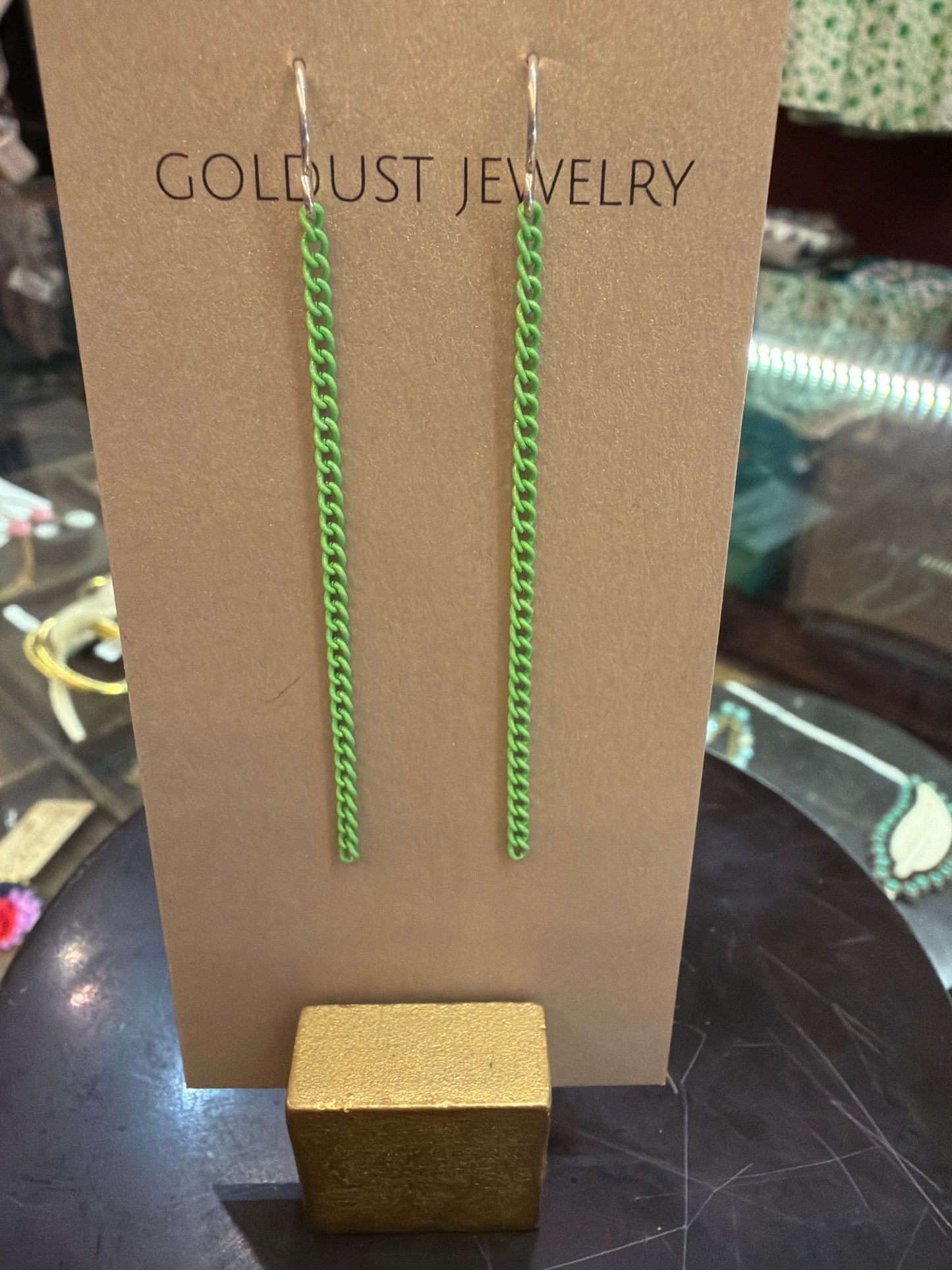 Goldust Jewelry GD colored chain earrings showing vibrant multi-colored chains with gold-tone hooks.