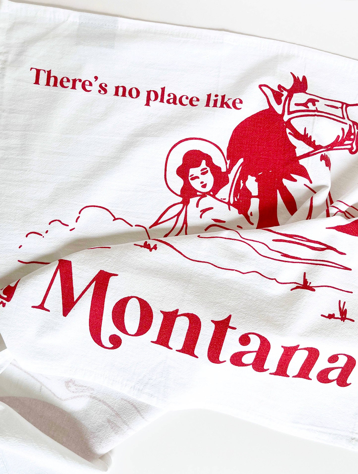No Place Like Montana cowgirl kitchen towel by The Coin Laundry with western-themed design and colorful southwestern patterns.