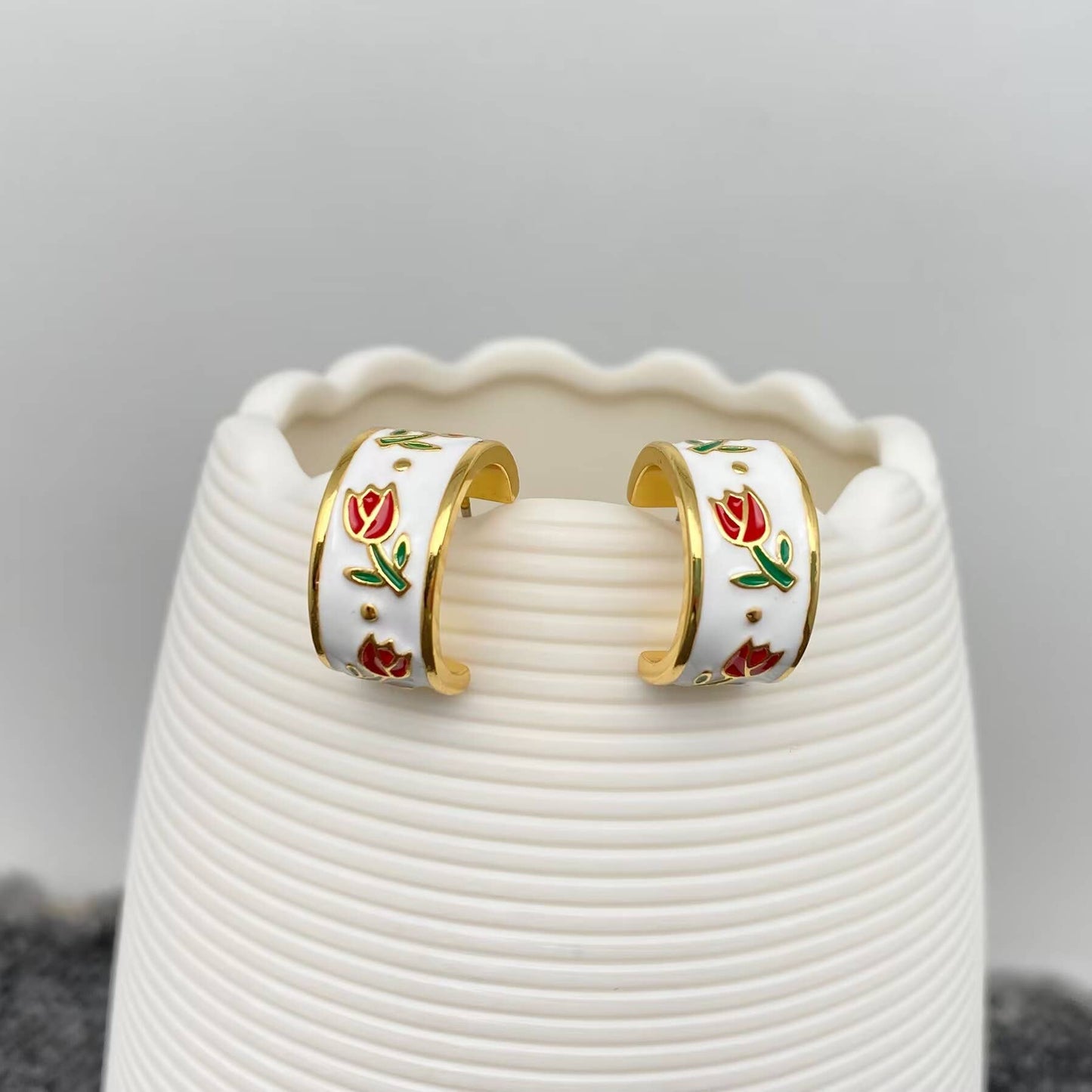 Mio Queena enamel tulip earrings featuring vibrant flower-shaped enamel design and gold-tone metal accents.