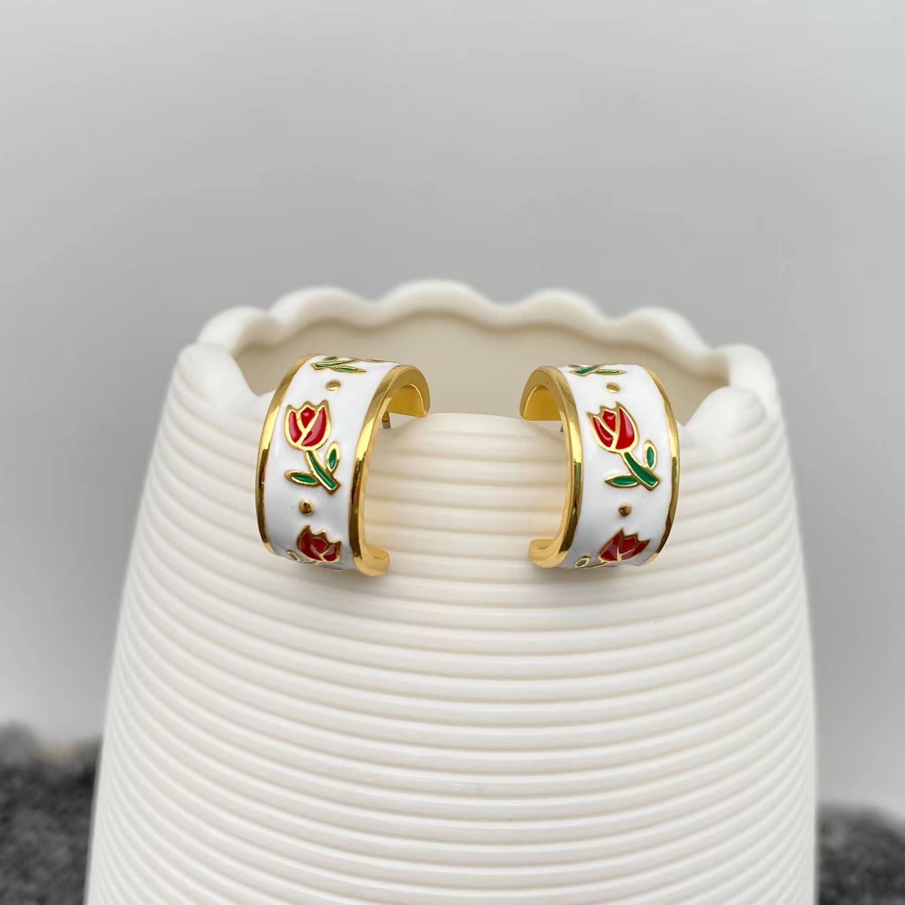 Mio Queena enamel tulip earrings featuring vibrant flower-shaped enamel design and gold-tone metal accents.