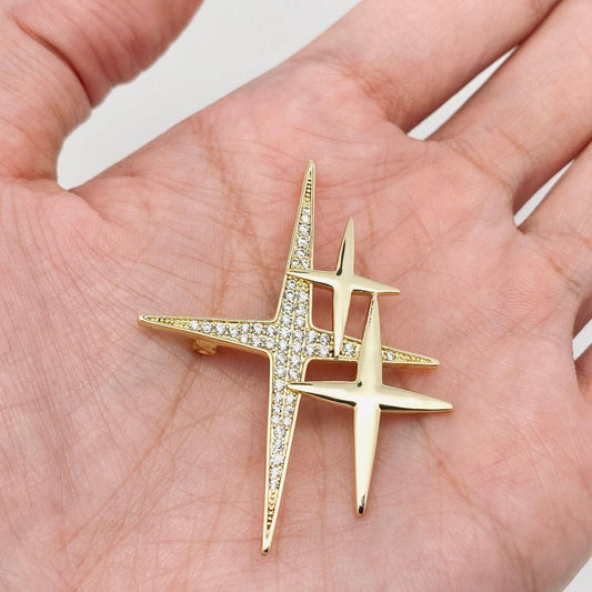 Mio Queena cubic zirconia star brooch pin with sparkling clear stones on silver-tone metal.