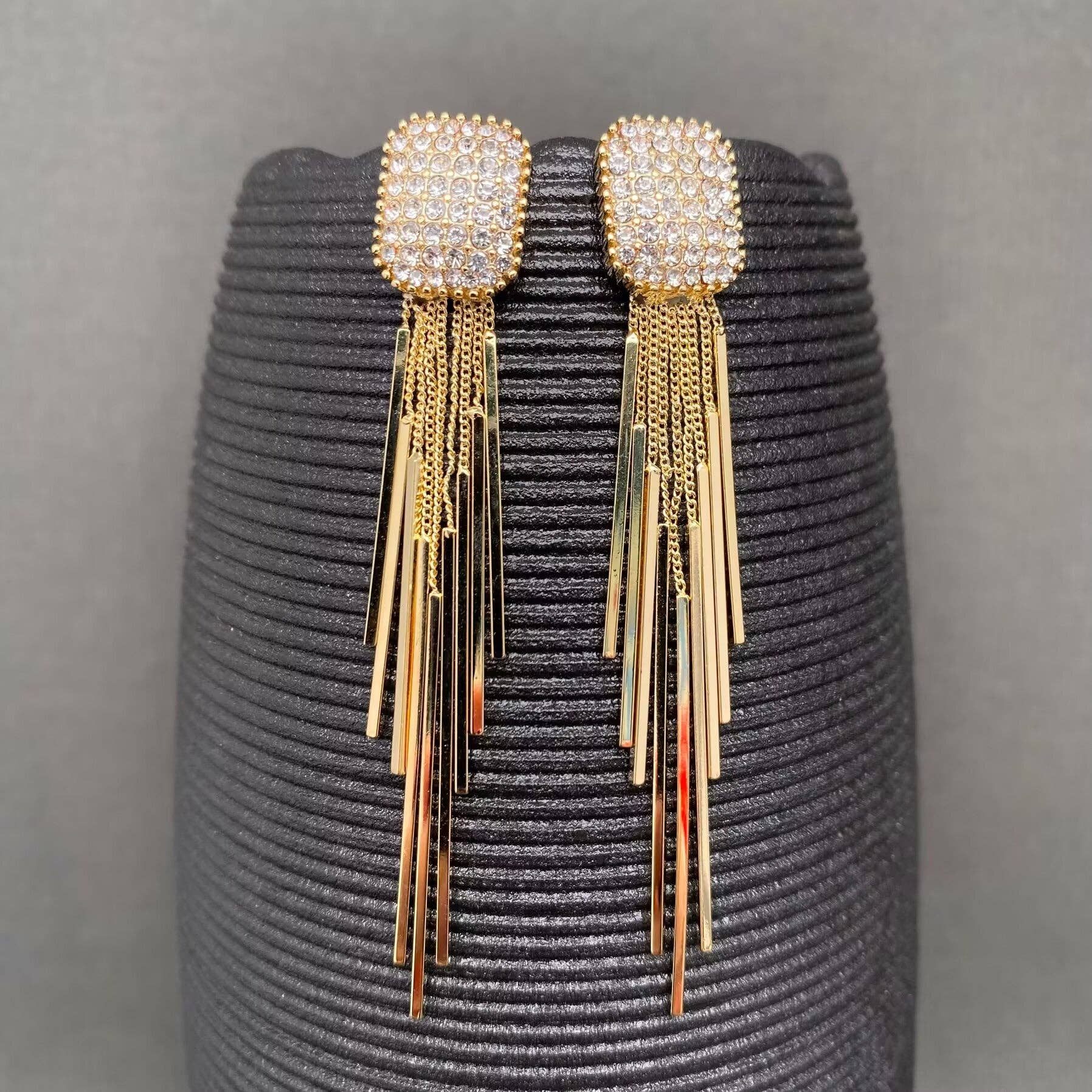 Gold fringe rhinestone earrings by Mio Queena featuring sparkling rhinestones and dangling fringe detail.