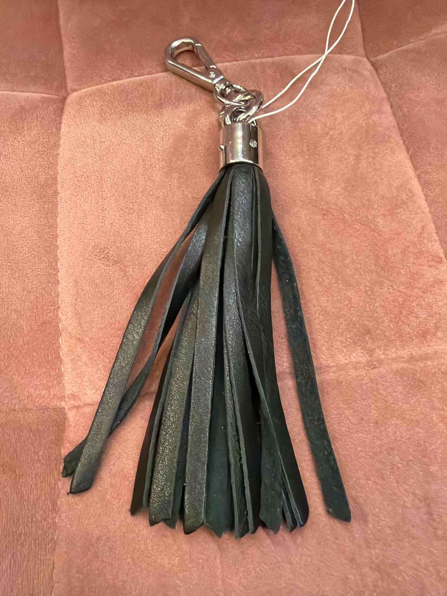 Leather tassel keychain by ili New York featuring a stylish leather tassel attached to a metal keyring.