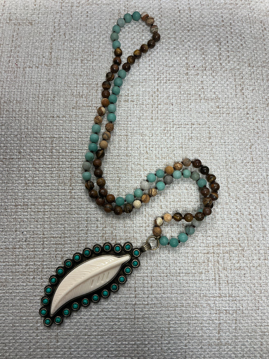Beaded feather talisman necklace with colorful beads and feather pendant, crafted by American Unique Group.