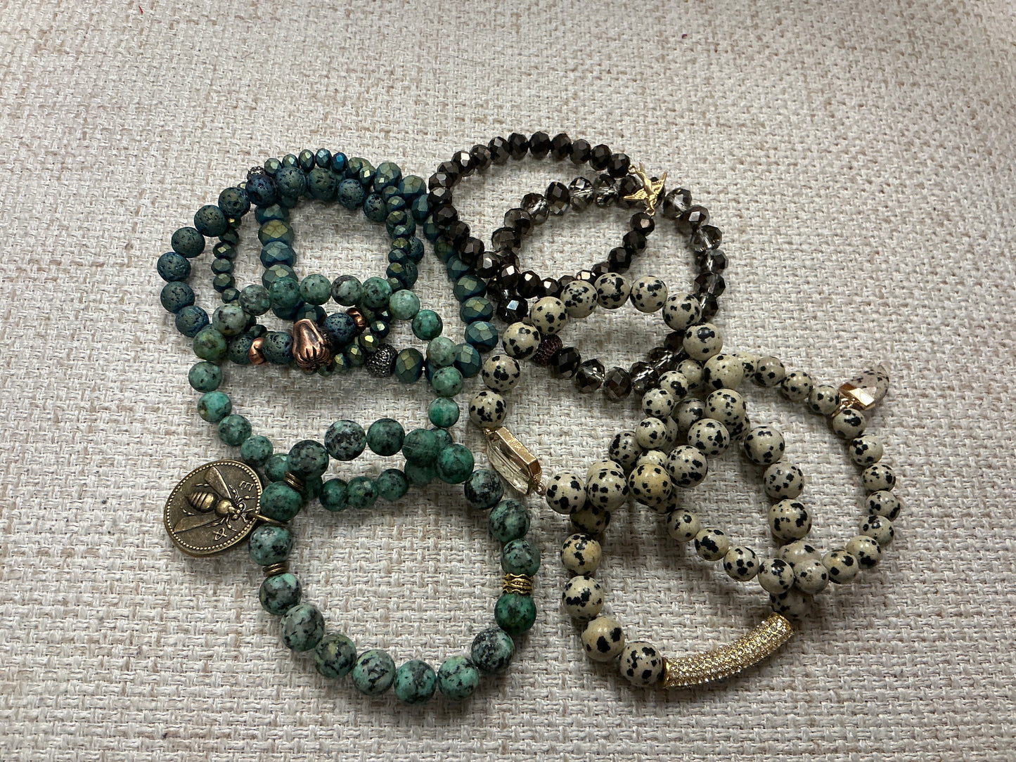 Stacked beaded bracelet set by American Unique Group featuring colorful, round beads on a stretchy bracelet for a stylish look.