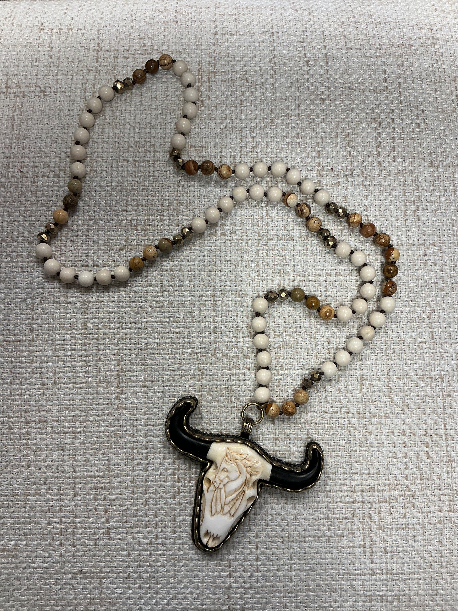 Beaded cow skull talisman necklace with colorful beads from American Unique Group, featuring a detailed cow skull pendant.