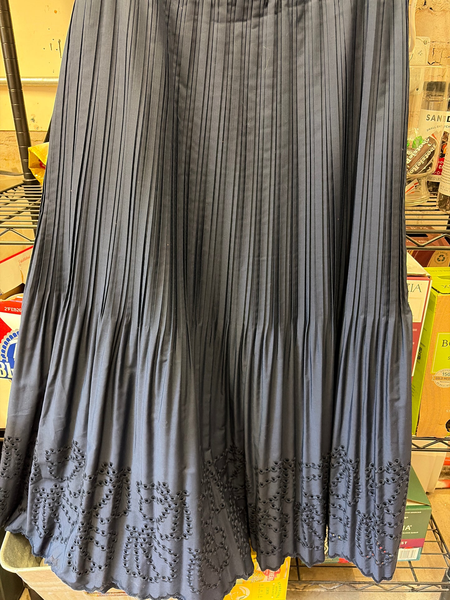 Navy eyelet maxi skirt by Current Air featuring a flowing design and eyelet detailing, displayed on a mannequin.