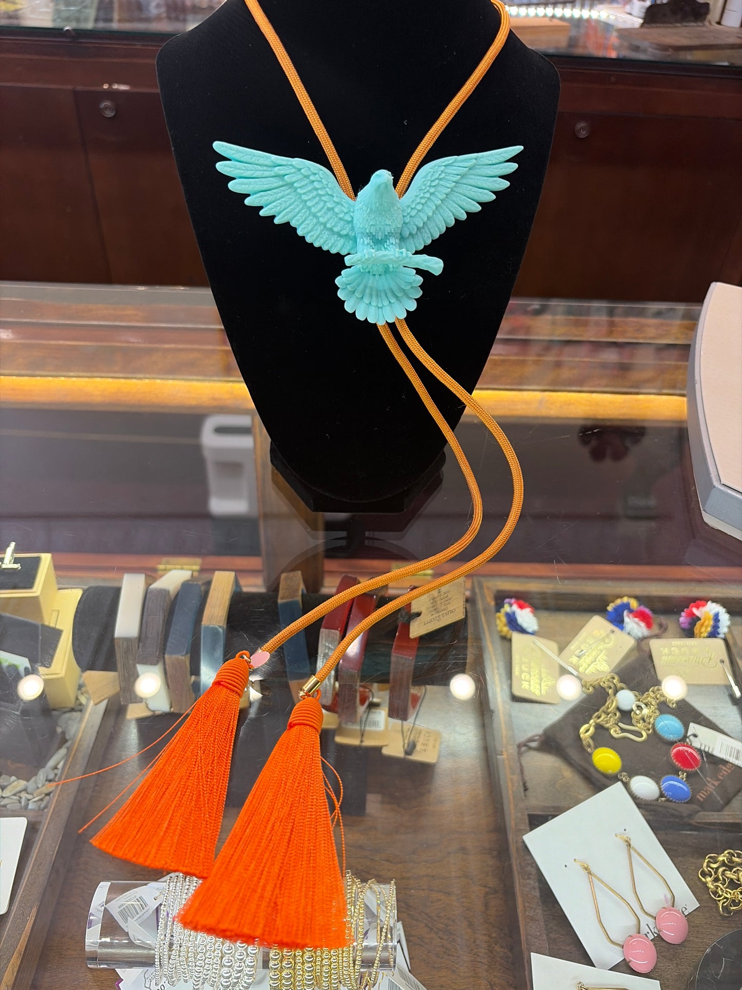 Rahya Bolo Necklace featuring a decorative bolo tie design with a silver-tone slide and cord, stylish jewelry by Rahya Jewelry Design